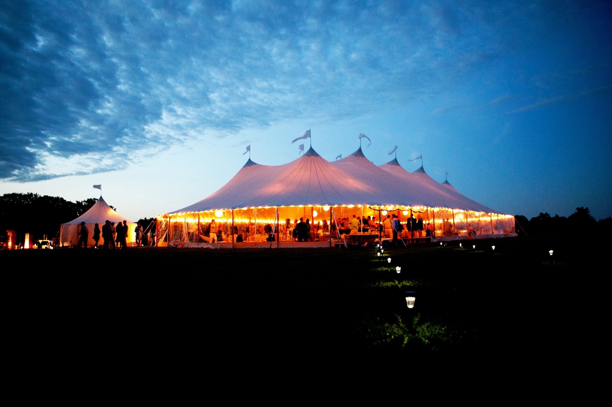 One of our beautiful Sperry tents at night. A beautiful Sperry tent wedding at night.