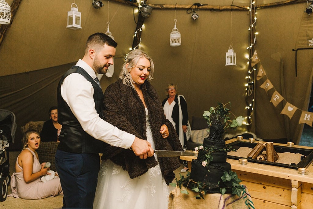 PapaKata Chilled DIY Festival Inspired Teepee Wedding Captured by Anna Wood Photography- Cutting the Wedding Cake PapaKata Chilled DIY Festival Inspired Teepee Wedding Captured by Anna Wood Photography- Cutting the Wedding Cake