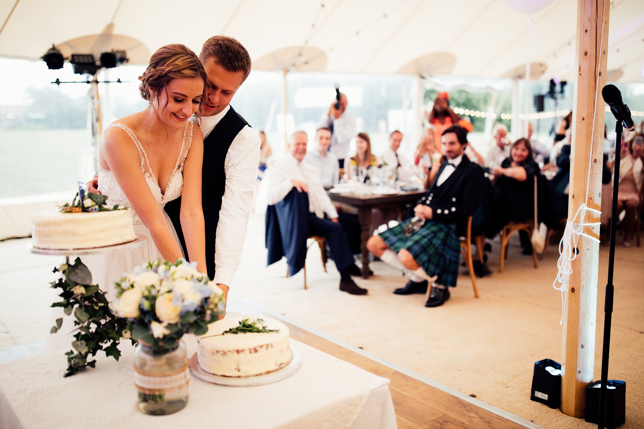 PapaKåta Sperry Wedding in Oxfordshire by Harry Michael Photography- Cutting the cake PapaKåta Sperry Wedding in Oxfordshire by Harry Michael Photography- Cutting the cake