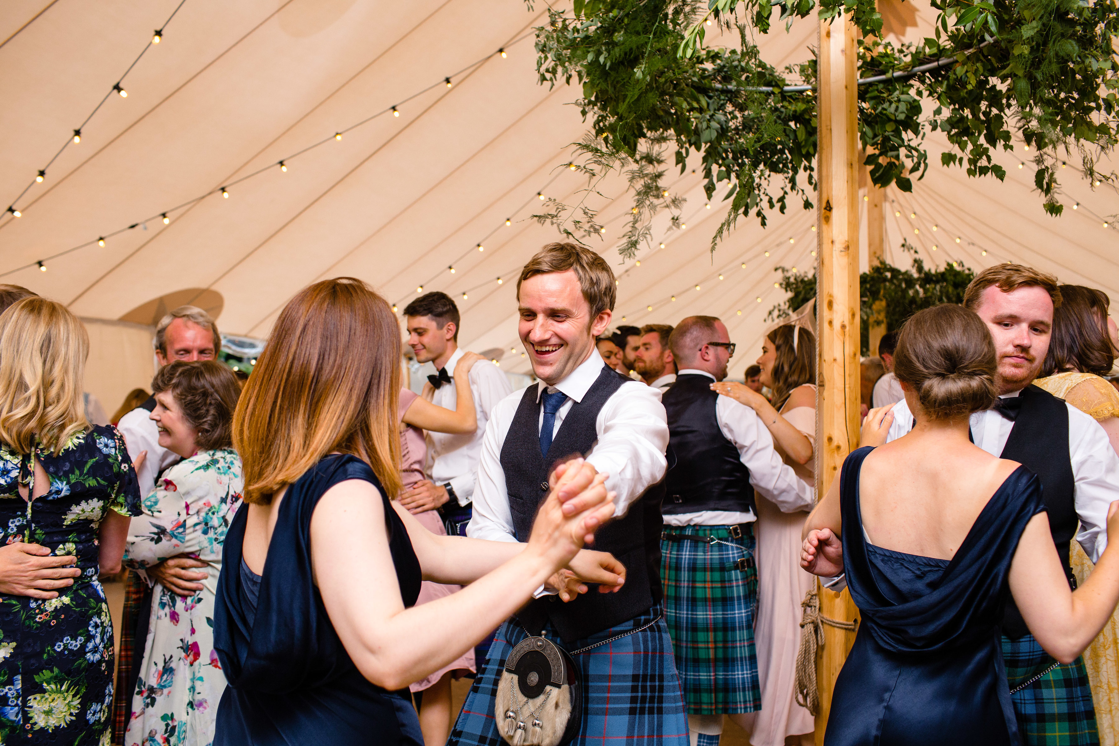 PapaKåta couple Lucy & Tom's Sperry Wedding at Gordon Castle Scotland captured by Helen Abraham Photography- Ceilidh dance