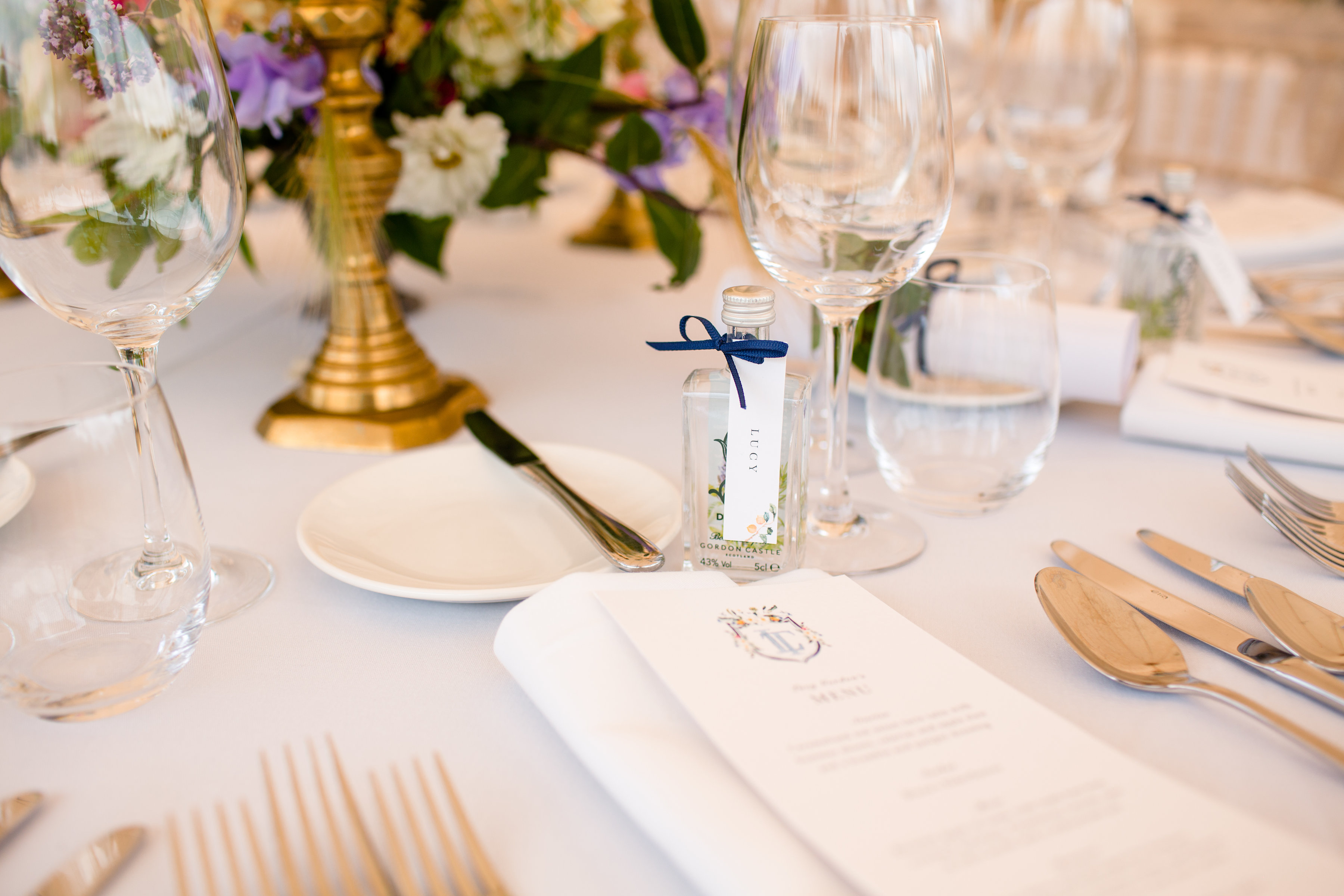PapaKåta couple Lucy & Tom's Sperry Wedding at Gordon Castle Scotland captured by Helen Abraham Photography- mini gin bottle wedding favours