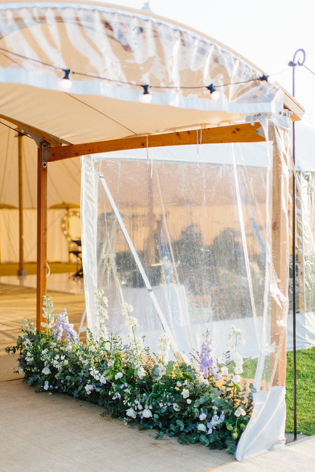 PapaKåta couple Georgina & Steve Sperry Tent Wedding in Barnby Dun, Doncaster captured by Melissa Beattie- Sperry Archway with floral designs by Lucy MacNicoll 