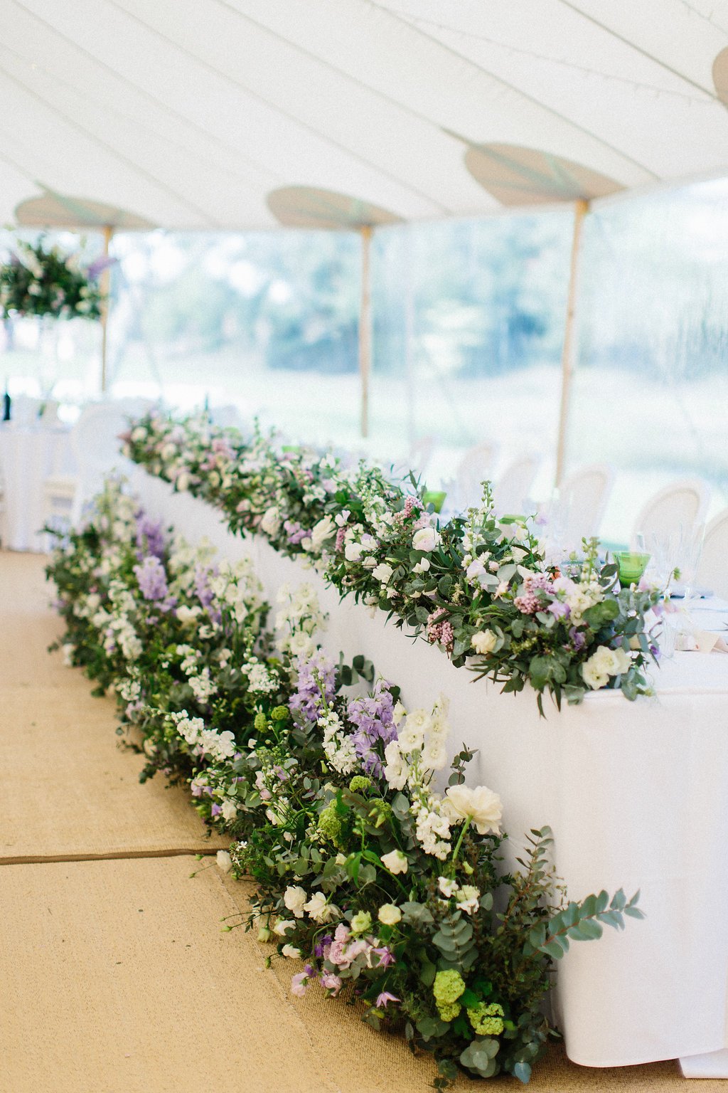 PapaKåta couple Georgina & Steve Sperry Tent Wedding in Barnby Dun, Doncaster captured by Melissa Beattie- Top table florals reused from the ceremony by Lucy MacNicoll 