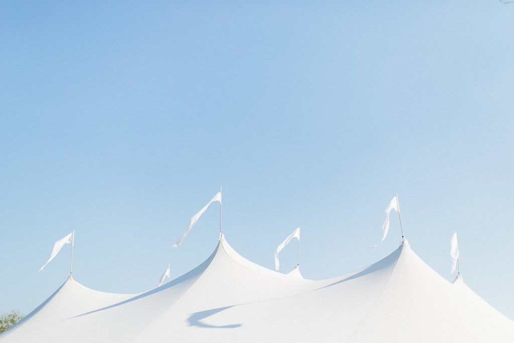 PapaKåta couple Georgina & Steve Sperry Tent Wedding in Barnby Dun, Doncaster captured by Melissa Beattie- Sperry Tent exterior flags
