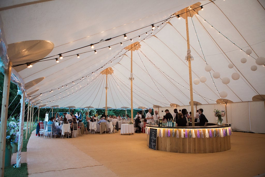 Georgie & Ben's PapaKåta Sperry Tent wedding at Newington House captured by Lucy Davenport: Sperry Tent interior with Festoon Drape
