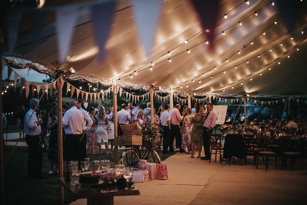 Katie & Thomas' PapaKåta Sperry Tent wedding in Thornborough, Bucks captured by Matt Horan Photography: Sperry Tent Interior with bunting 