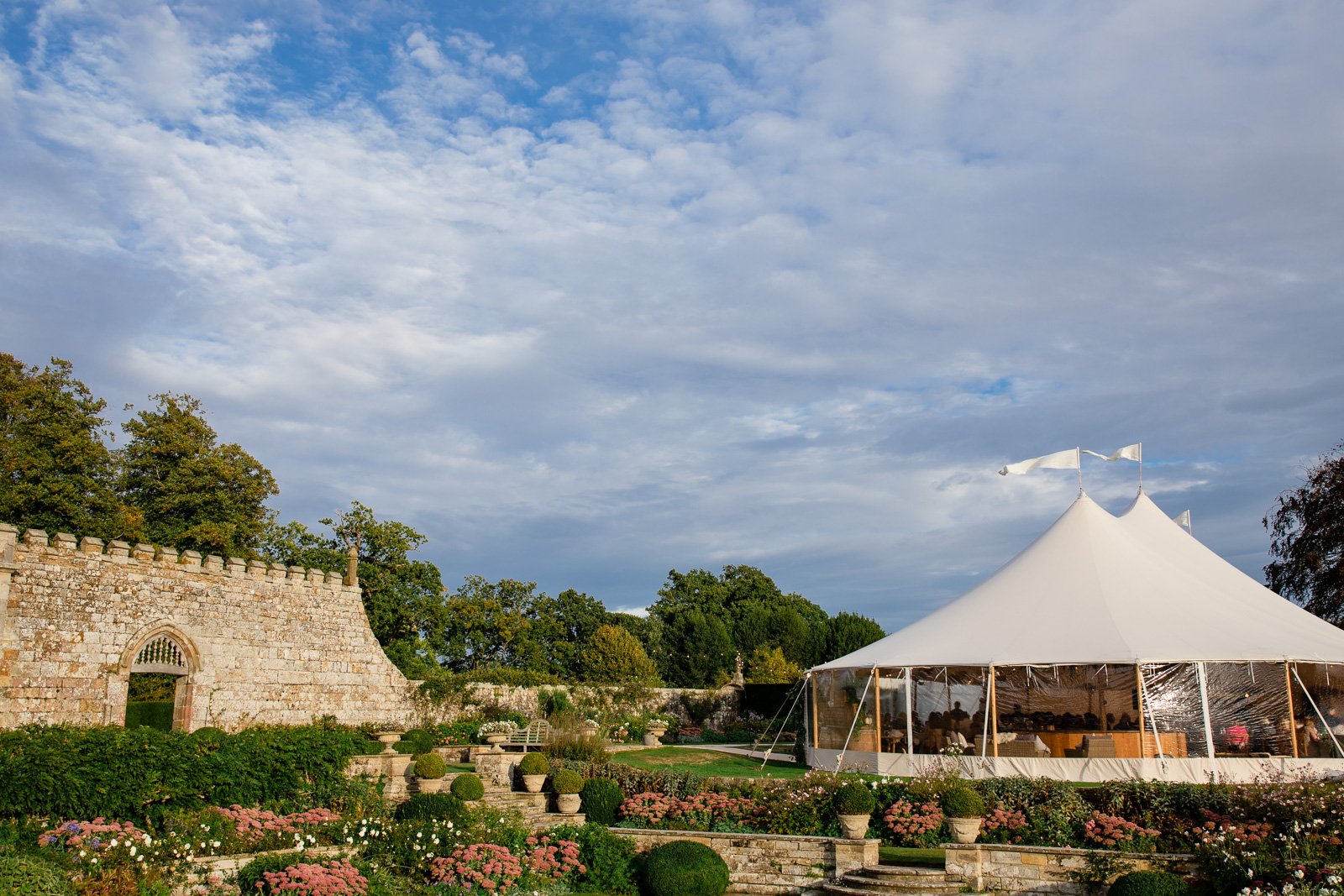 Emily & Ed's PapaKåta Sperry Tent wedding at Buckhurst Park captured by Tony Hart Photography: Sperry Tent exterior in walled garden