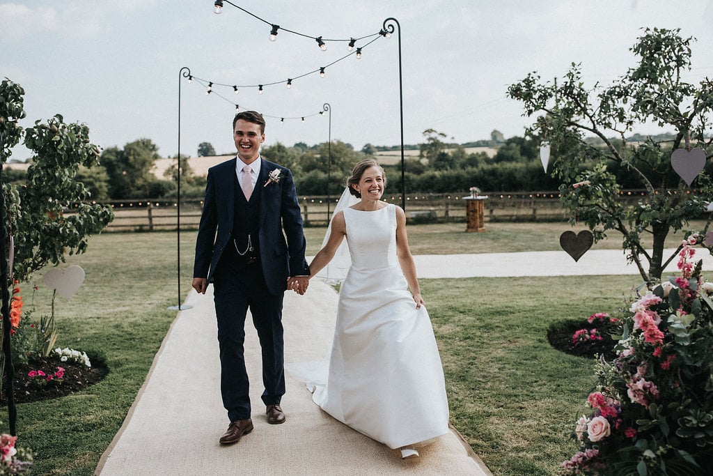 Katie & Thomas' PapaKåta Sperry Tent wedding in Thornborough, Bucks captured by Matt Horan Photography: Making an entrance, Festoon Walkway 
