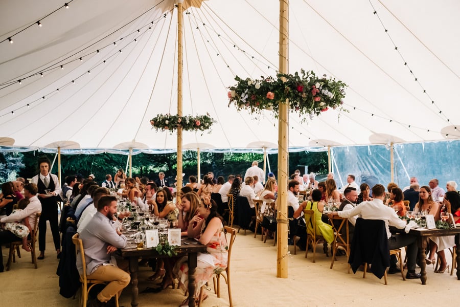 Natalie & Jack's PapaKåta Sperry Tent wedding at Lingholm Estate, Keswick, Lake District captured by Kristian Leven Photography: Wedding Guests and Sperry Tent Interior 