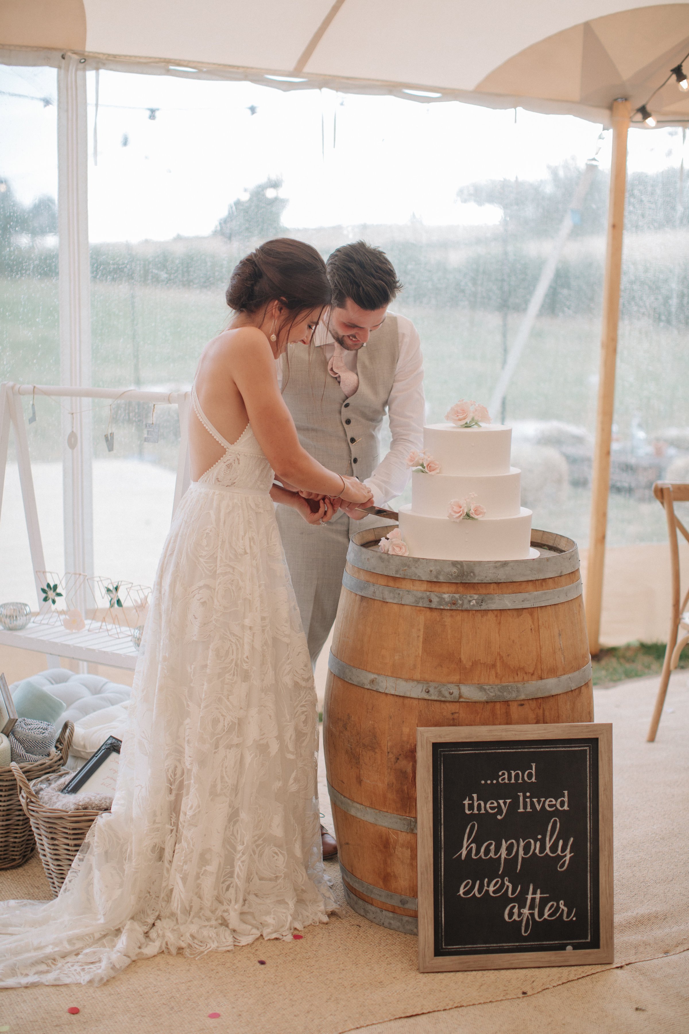 Steph & Ed's PapaKåta Sperry Tent wedding at home in Nottingham captured by M & J Photography: Cutting the Cake