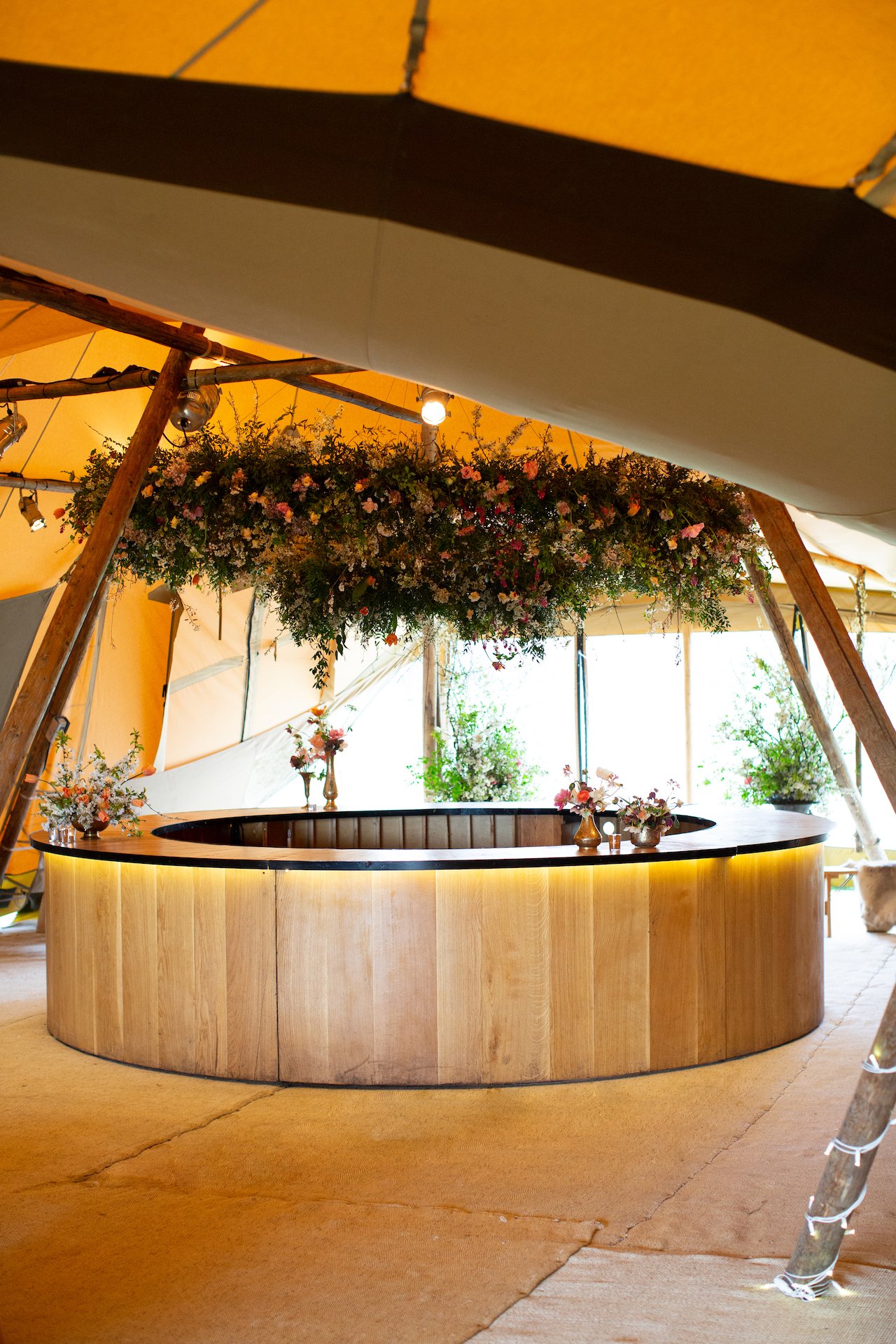 PapaKåta Spring Open Weekend Teepee captured by Lucy Davenport Photography: Circular Oak Bar 