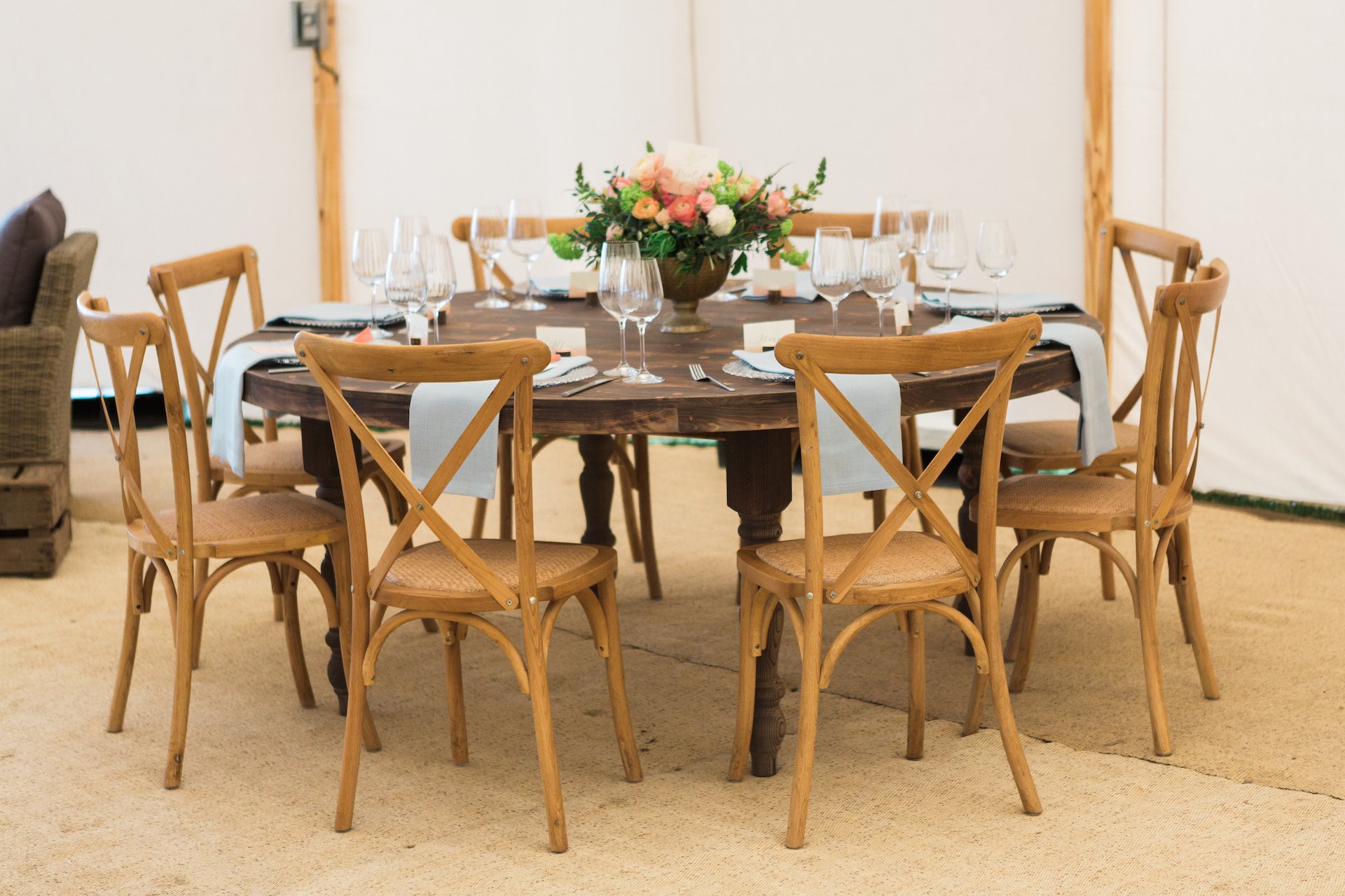 PapaKåta Spring Open Weekend Sperry Tent captured by Lucy Davenport Photography: Round Farmhouse Table with Cross Back Chairs