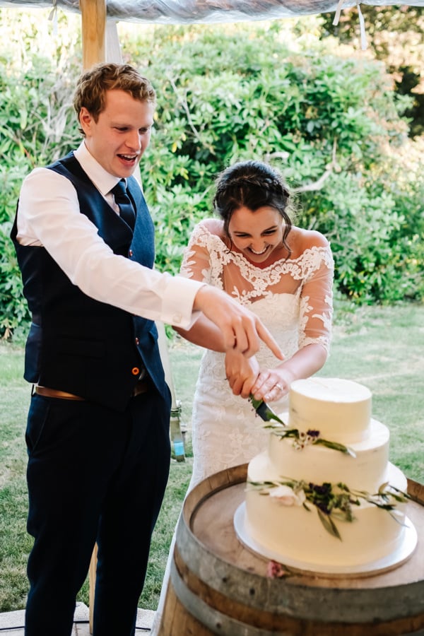 Natalie & Jack's PapaKåta Sperry Tent wedding at Lingholm Estate, Keswick, Lake District captured by Kristian Leven Photography: Cutting the Cake 