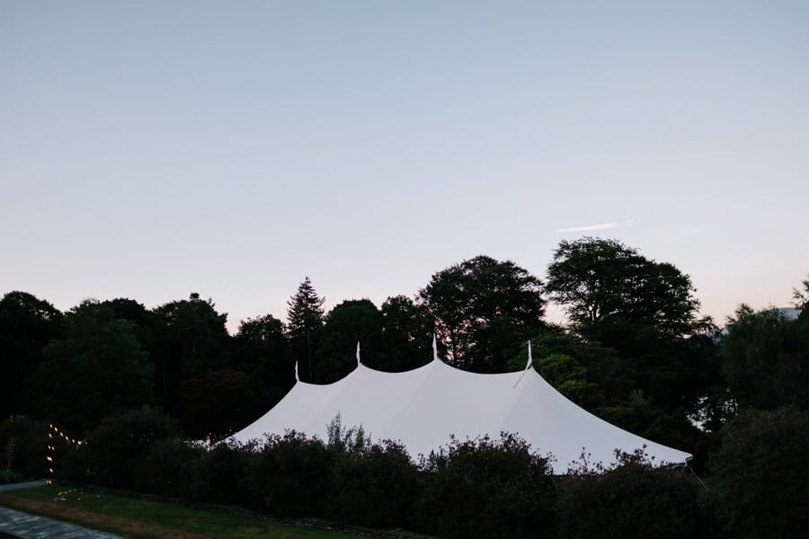 Natalie & Jack's PapaKåta Sperry Tent wedding at Lingholm Estate, Keswick, Lake District captured by Kristian Leven Photography: Sperry Tent External at Night 