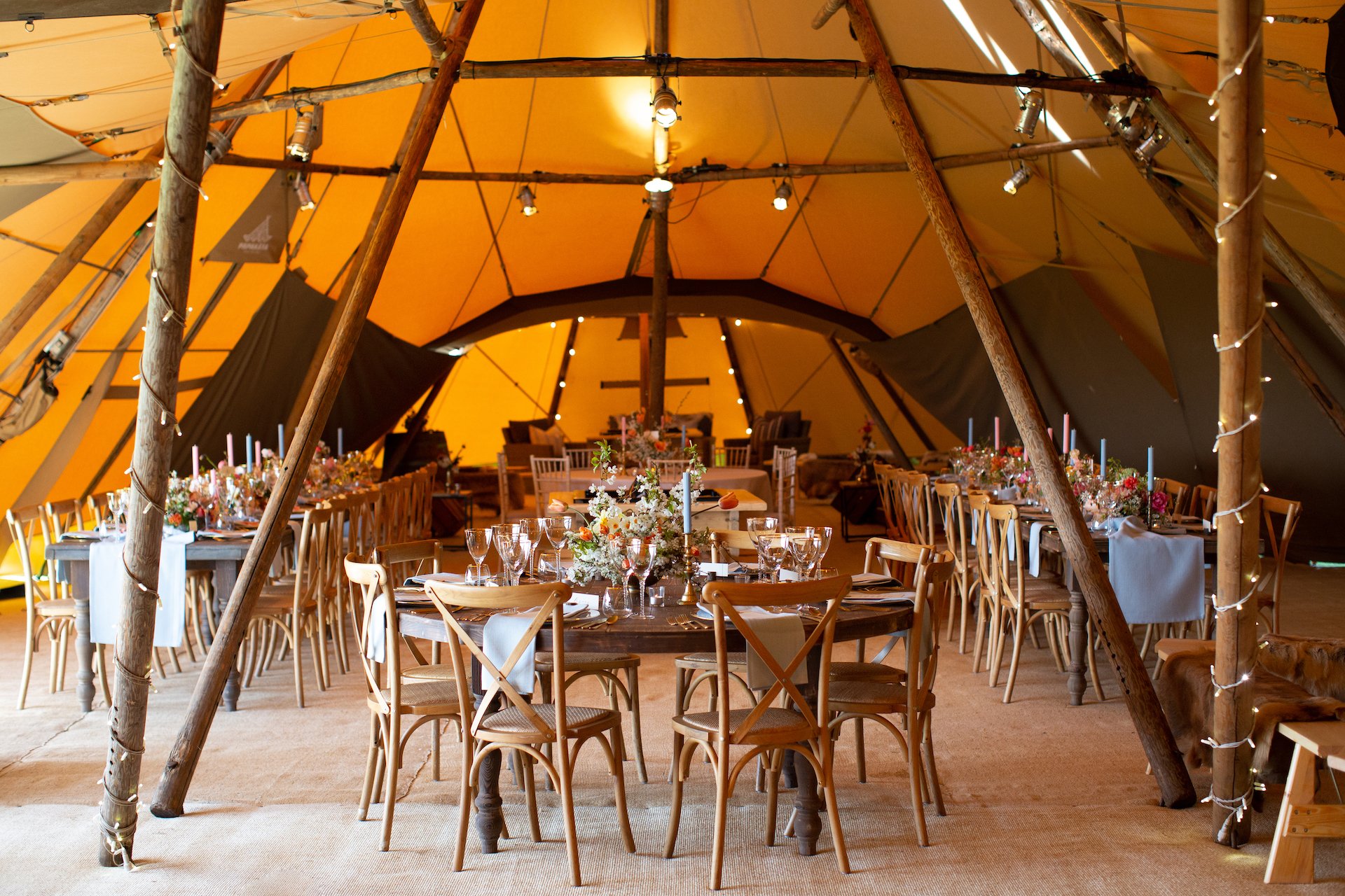PapaKåta Spring Open Weekend Teepee captured by Lucy Davenport Photography: Round Farmhouse Tables & Cross Back Chairs 