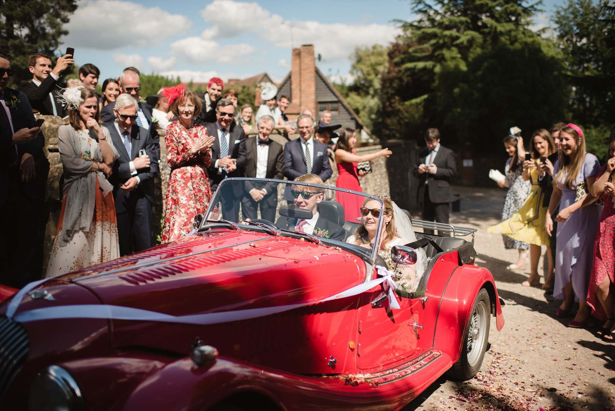 Frances & Ivo PapaKåta Sperry Tent Wedding at the Beautiful Stonor Park, Oxfordshire, Emma Hare Photography; Driving Off In The Wedding Car