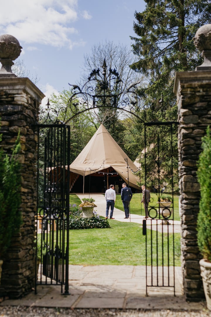 Sarah & Billy PapaKåta Tipi Tent Wedding, John Hope Photography; Tipi Tent Peaking through Gates
