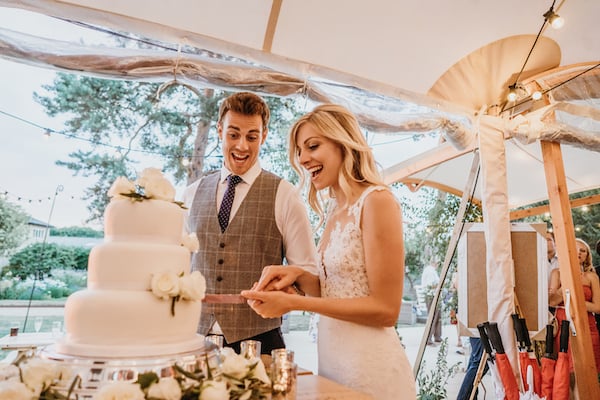Anna & Luke PapaKåta Sperry Tent Wedding, Cambridgeshire, Matthew Wilkinson Photography; Cutting The Cake