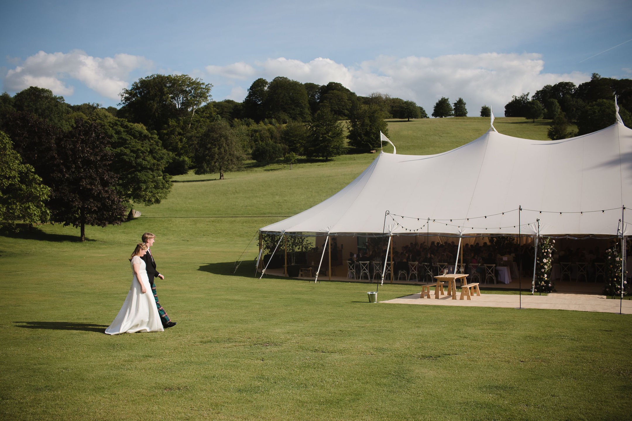 Frances & Ivo PapaKåta Sperry Tent Wedding at the Beautiful Stonor Park, Oxfordshire, Emma Hare Photography; Bride & Groom Walking To Sperry