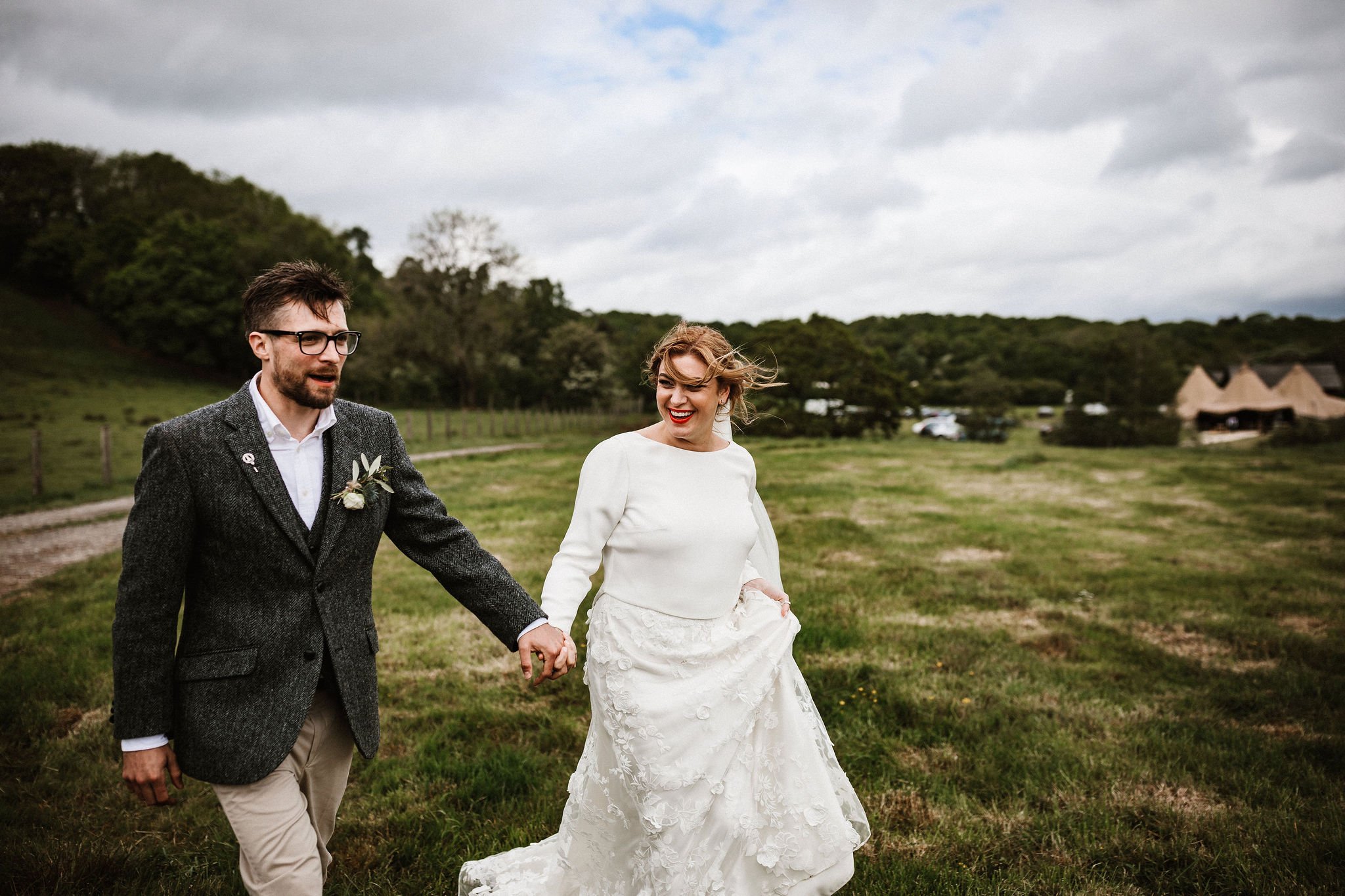 Katie & Jes PapaKata Tipi Wedding, Hidden River Cabins, Ally M Photography; Bride & Groom Holding Hands