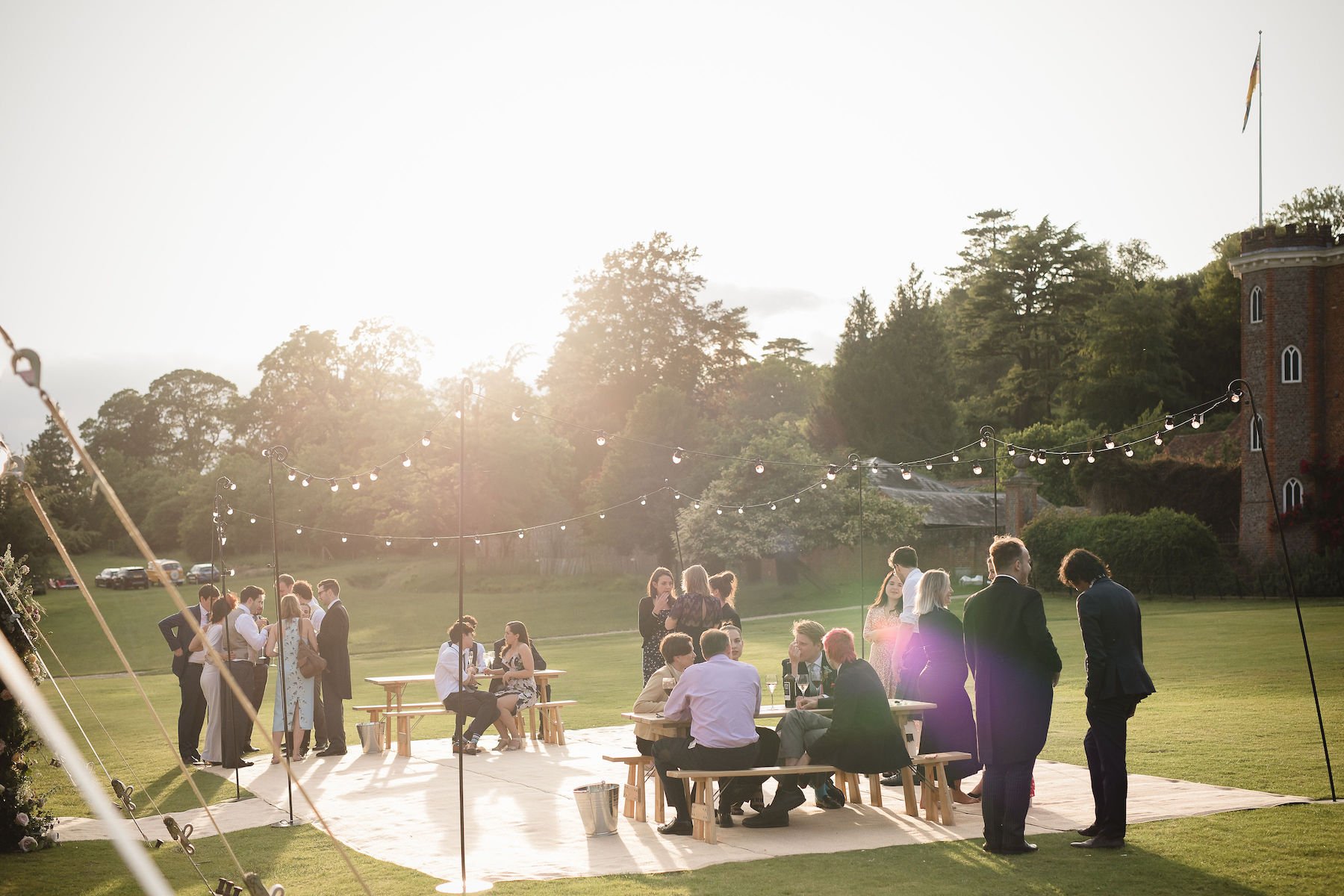 Frances & Ivo PapaKåta Sperry Tent Wedding at the Beautiful Stonor Park, Oxfordshire, Emma Hare Photography; Festoon Terrace With Sunset