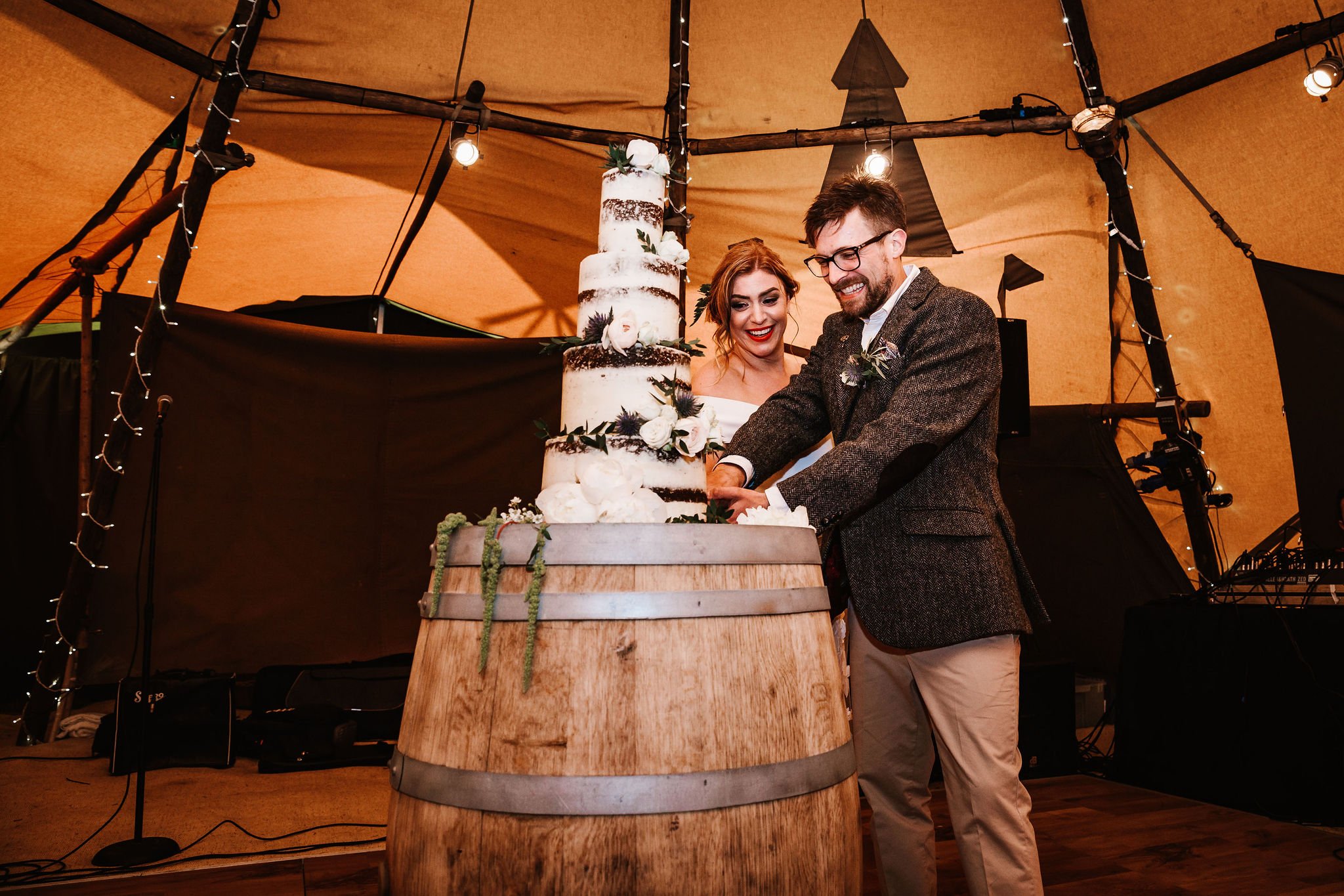 Katie & Jes PapaKata Tipi Wedding, Hidden River Cabins, Ally M Photography; Cutting the Cake