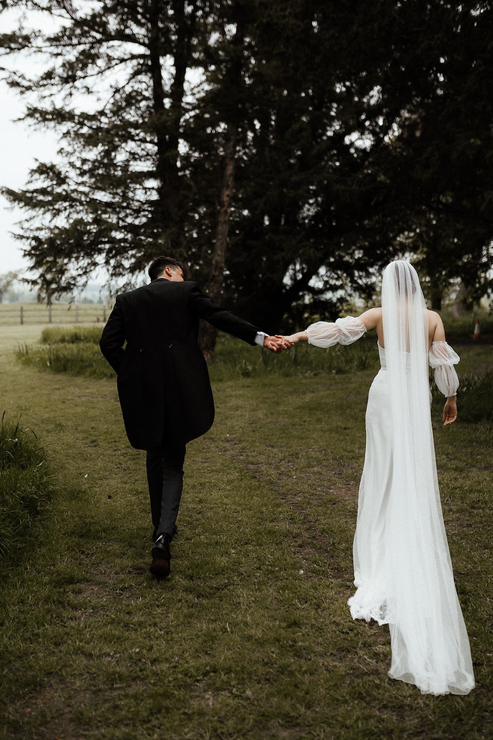 India & Sean PapaKåta Sperry Tent Wedding in Lincolnshire, Yorkshire, Caitlin & Jones Photography; Holding Hands