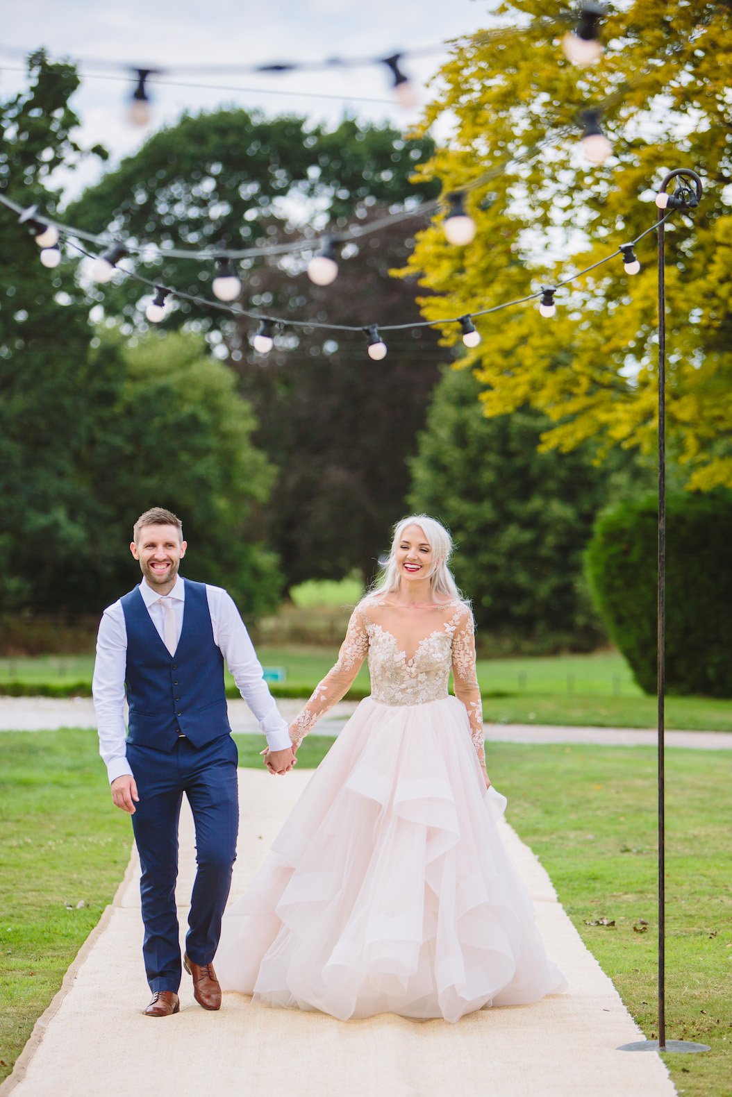 Sarah & Greg PapaKåta Sperry Tent Wedding at Saltmarshe Hall in Howden, Yorkshire. Photographed by Barnaby Aldrick; The New Mr & Mrs on Festoon Walkway