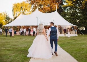 Sarah & Greg PapaKåta Sperry Tent Wedding at Saltmarshe Hall in Howden, Yorkshire. Photographed by Barnaby Aldrick; Bride & Groom Entering The Sperry Tent