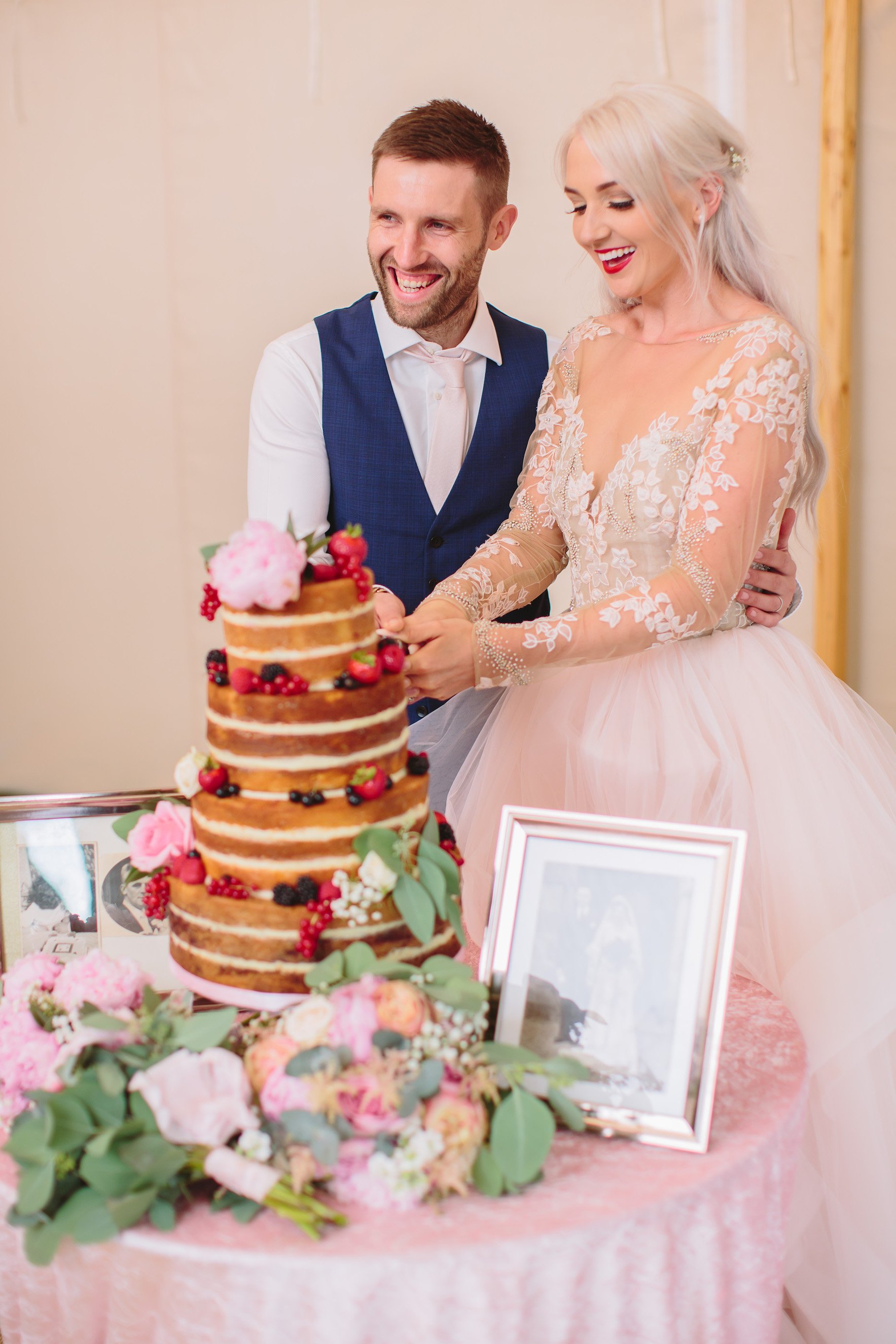 Sarah & Greg PapaKåta Sperry Tent Wedding at Saltmarshe Hall in Howden, Yorkshire. Photographed by Barnaby Aldrick; Cut the Cake