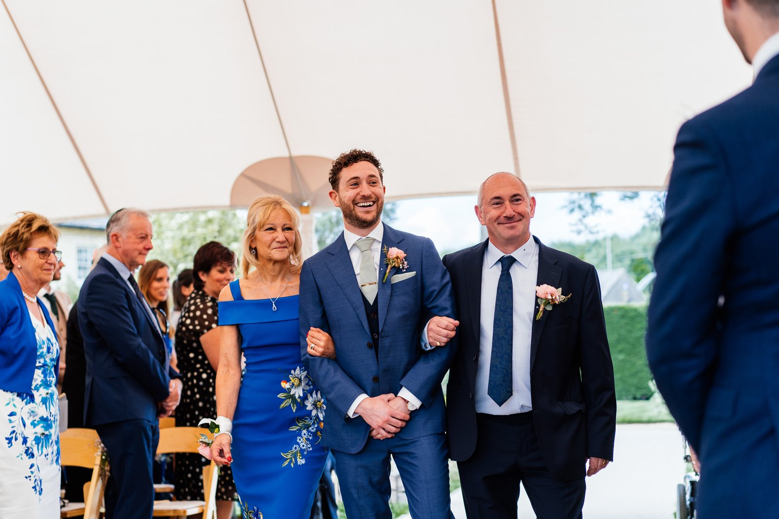 Alana & Adam Stunning PapaKåta Sperry Tent Wedding in Huntingdon, Cambridgeshire. Photography by Aaron Collett; Groom walking down the Aisle