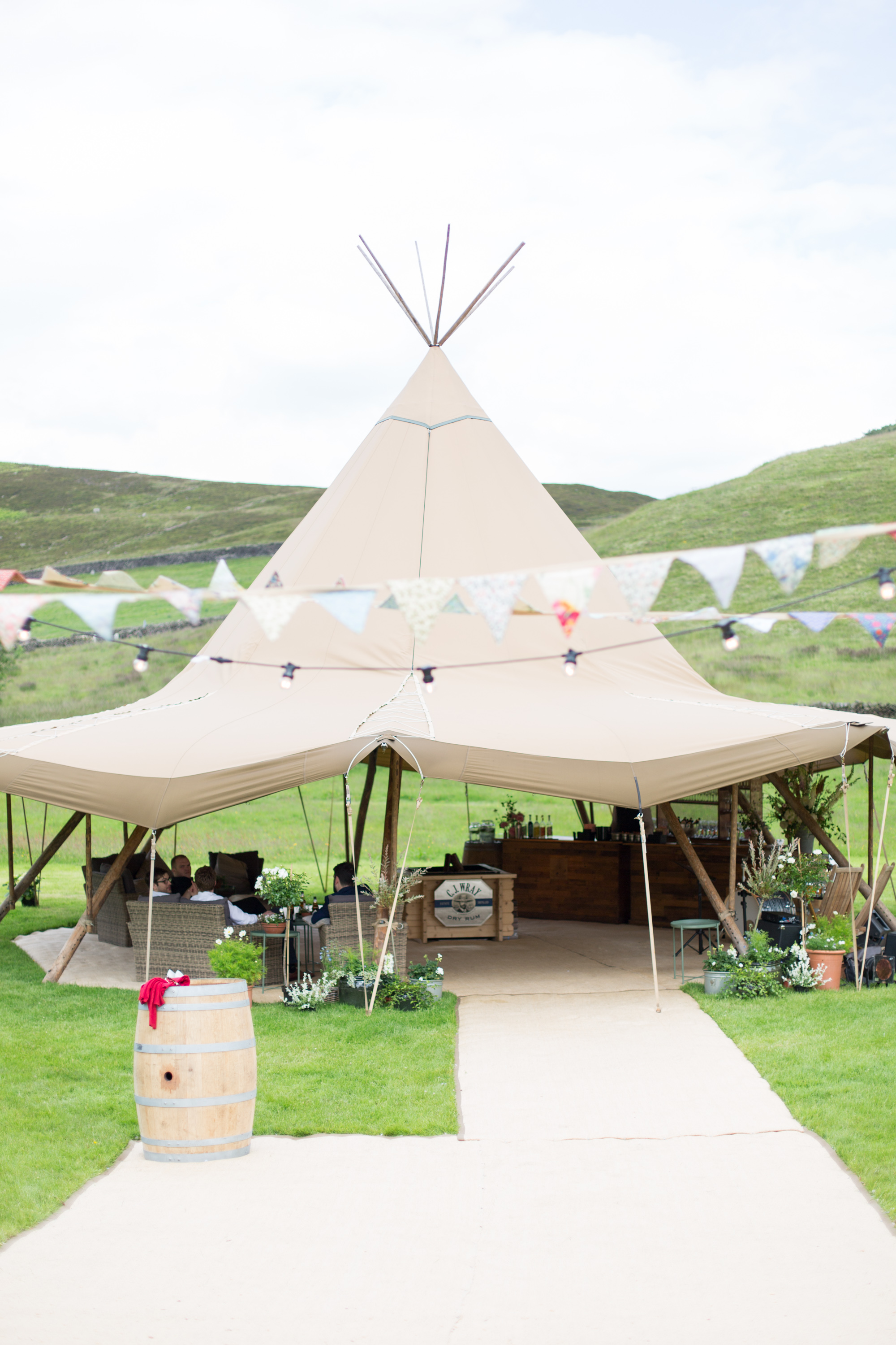 Jess & Rob's stunning PapaKåta Tipi Tent Wedding in Ilkley, West Yorkshire. Photography by Helen Warner; Witches Hat with Bunting 