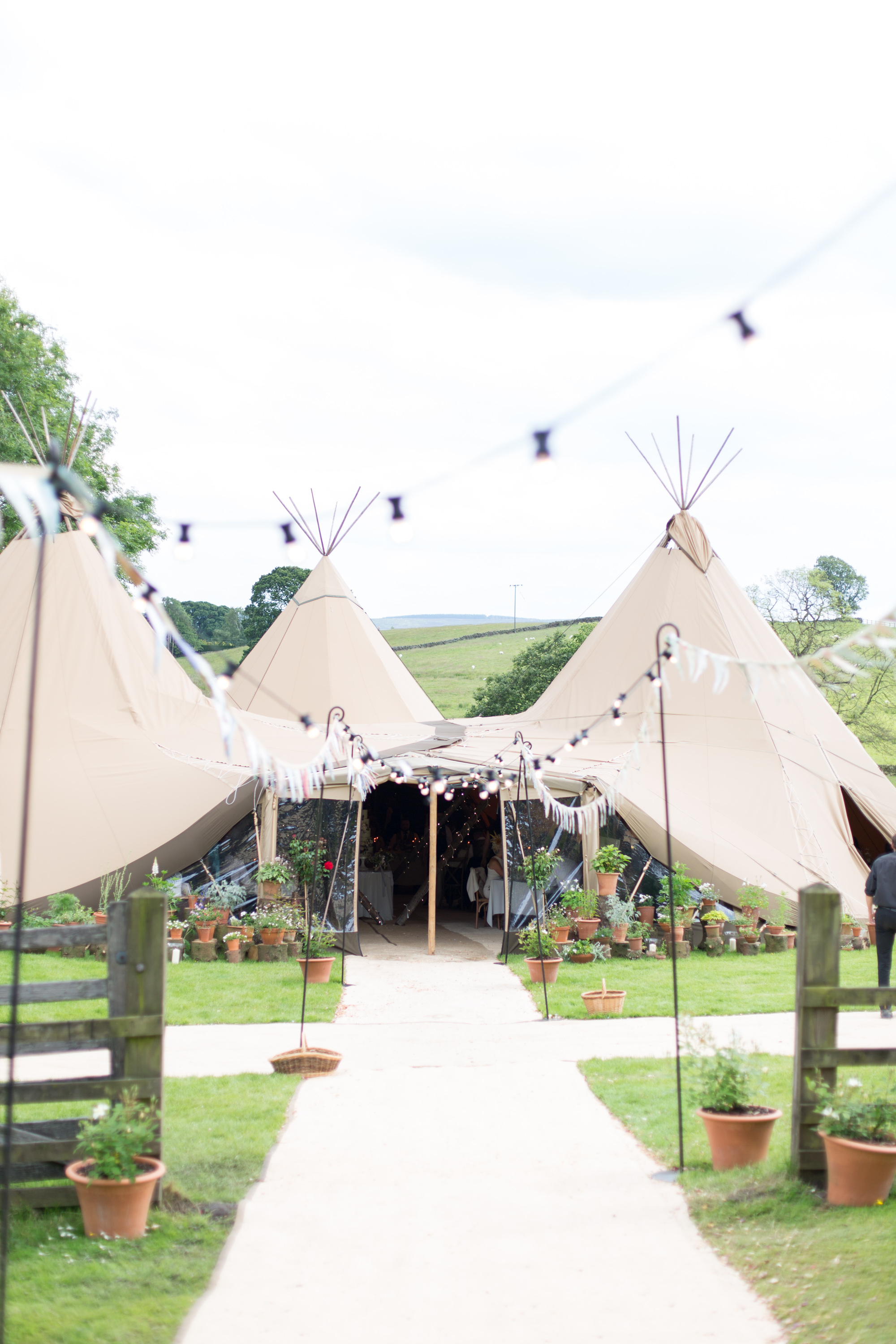 Jess & Rob's stunning PapaKåta Tipi Tent Wedding in Ilkley, West Yorkshire. Photography by Helen Warner; Festoon Walkway