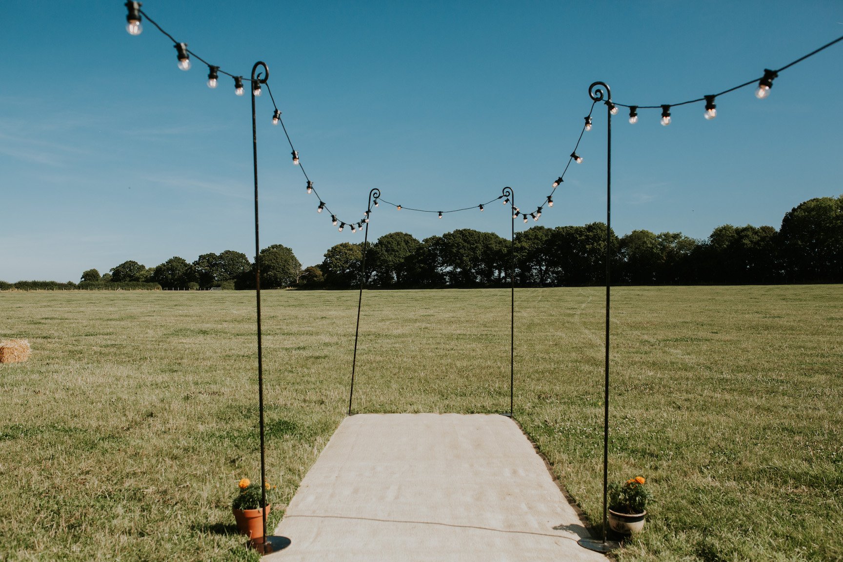 Katie & Tim Gorgeous PapaKåta Tipi Tent Wedding at Hawbridge Farm. Photographed by Hayley Savage Photography; Festoon Walkway