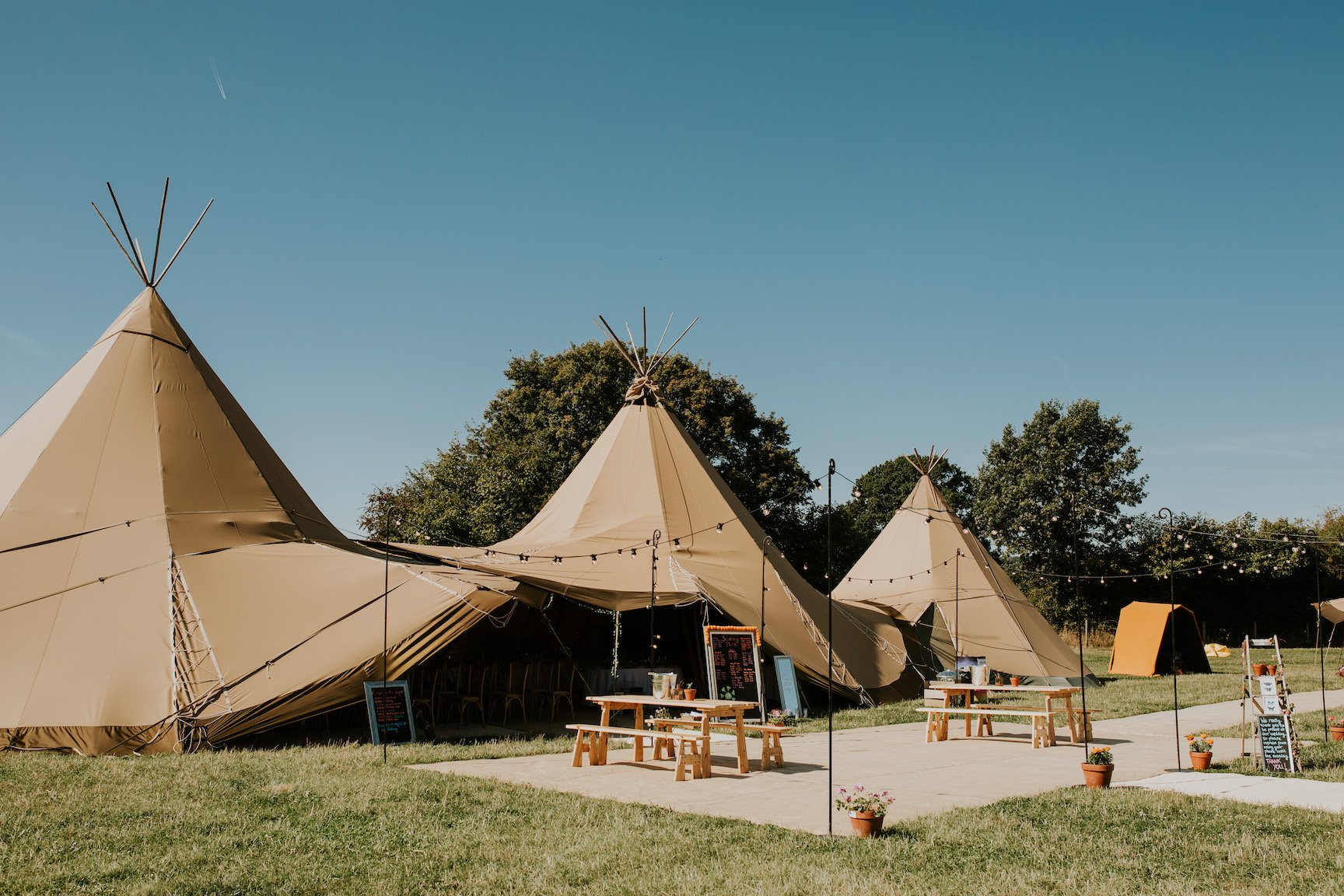 Katie & Tim Gorgeous PapaKåta Tipi Tent Wedding at Hawbridge Farm. Photographed by Hayley Savage Photography; Tipi Set Up with Festoon Terrace