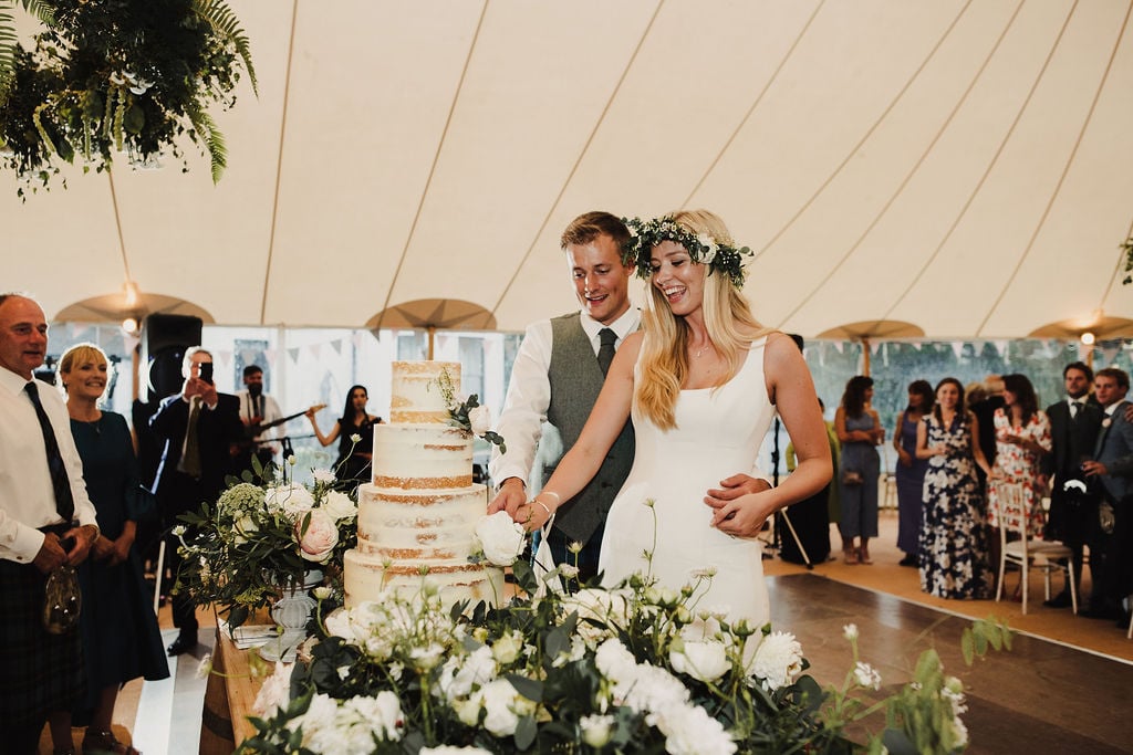 Ruth & Alex PapaKåta Sperry Tent Wedding in Angus, Scotland. Photographed by Anna Urban Photography; Cut the Cake