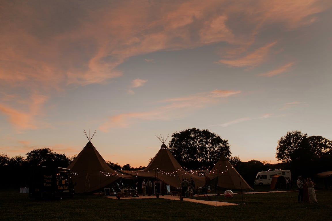 Katie & Tim Gorgeous PapaKåta Tipi Tent Wedding at Hawbridge Farm. Photographed by Hayley Savage Photography; Pink Skies Festoon Walkway