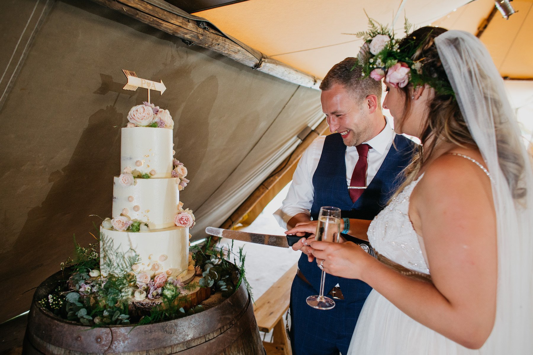 Alicia & Phil Gorgeous PapaKåta Tipi Tent Wedding in North Yorkshire. Photographed by John Hope Photography; Cut the Cake!